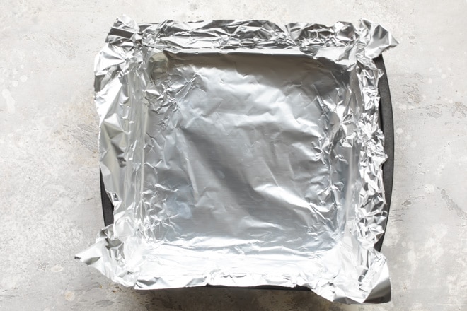 A square baking pan lined with tin foil.