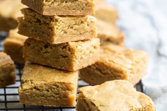 Blondies on a stack on a cooling rack.