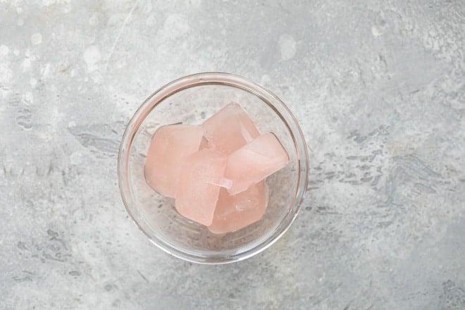 Frozen cubes of rose in a clear bowl.
