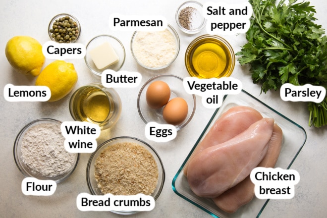 Labeled chicken piccata ingredients in bowls.