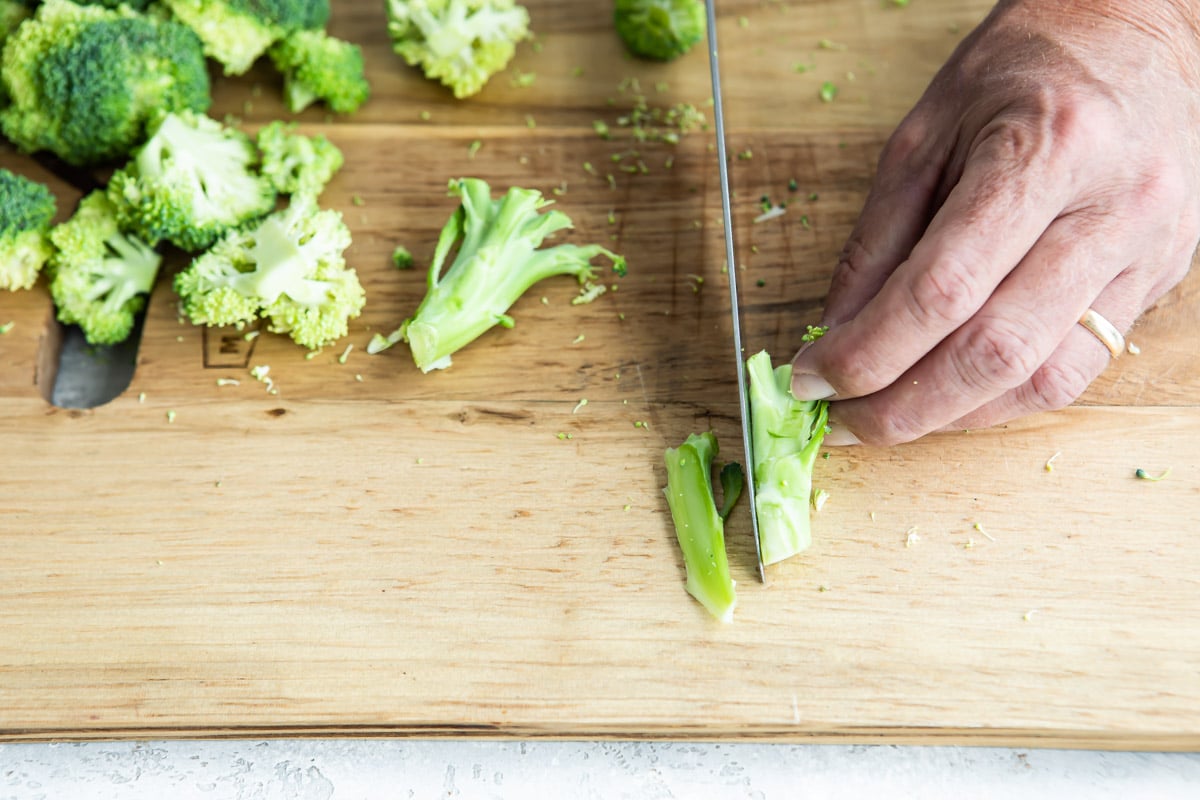 Cutting broccoli stalks into even pieces.