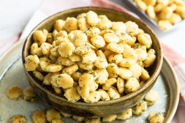 Ranch oyster crackers in a brown bowl.
