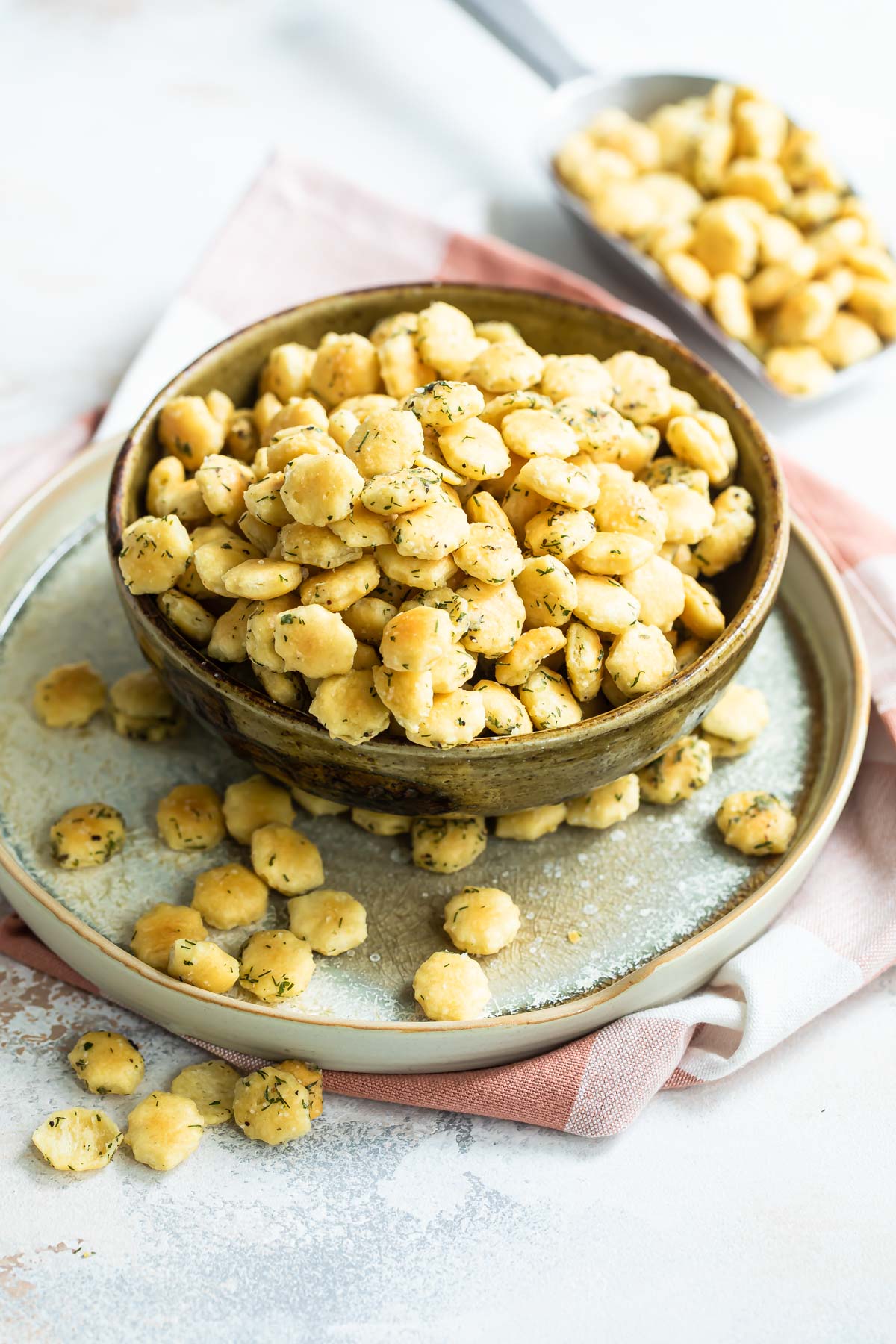 Ranch oyster crackers in a brown bowl.
