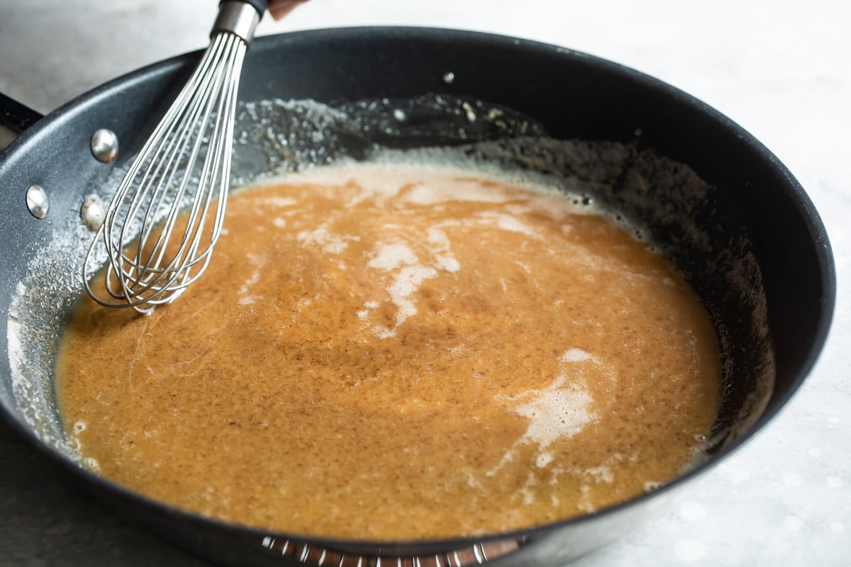 Roux for shrimp creole in a black skillet.