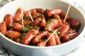 Barbecue little smokies in a white bowl.