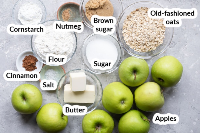 Labeled apple crisp ingredients in bowls.