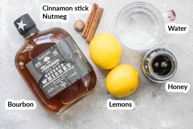 Labeled hot toddy ingredients on a countertop.
