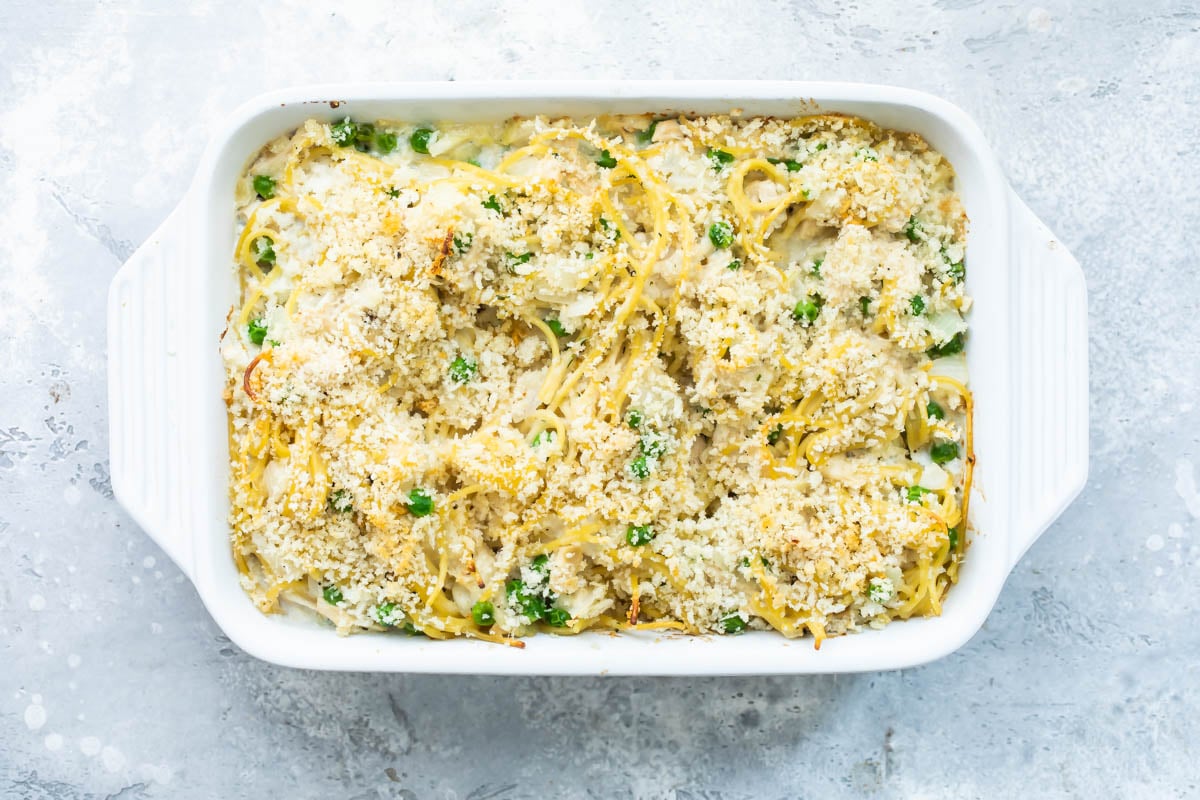 Turkey tetrazzini in a white baking dish after being cooked.