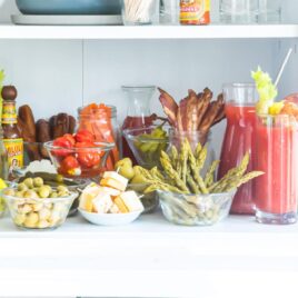 A bloody mary bar set up on a countertop.