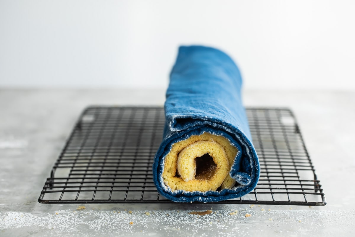 A roll cake rolled up in a towel.