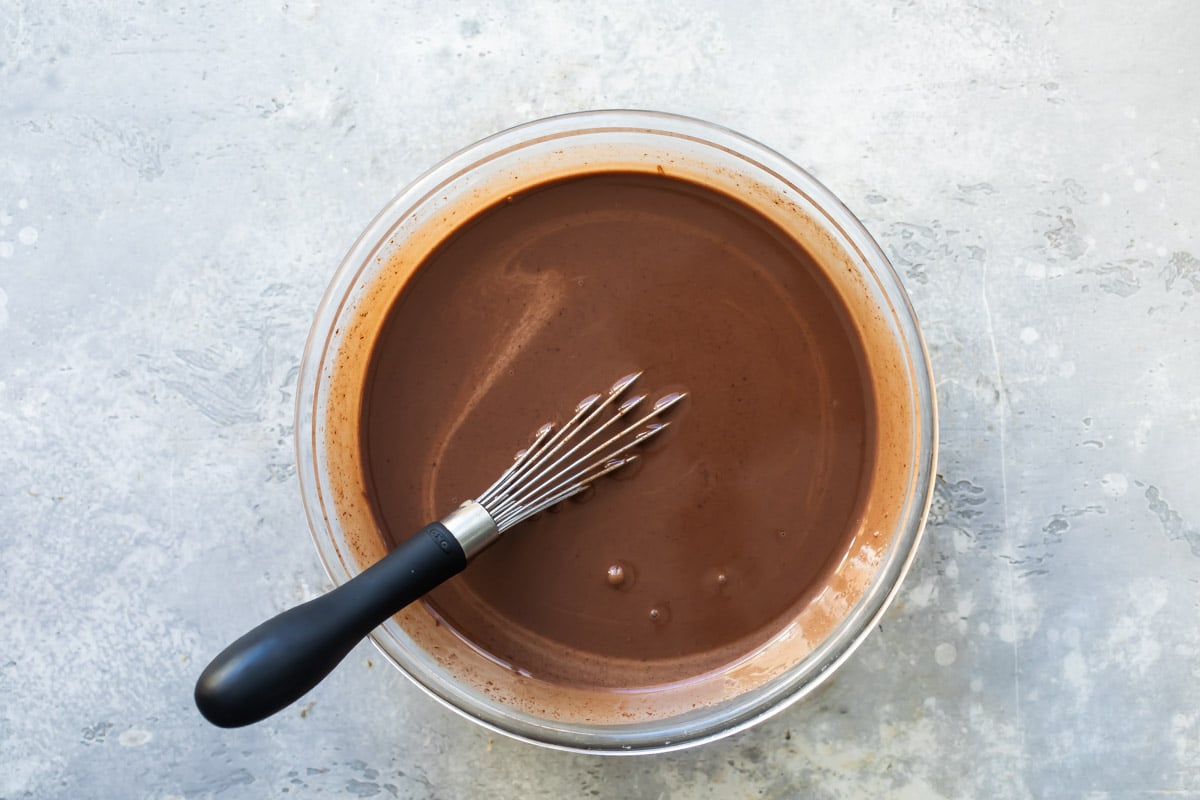 Chocolate ganache in a saucepan.