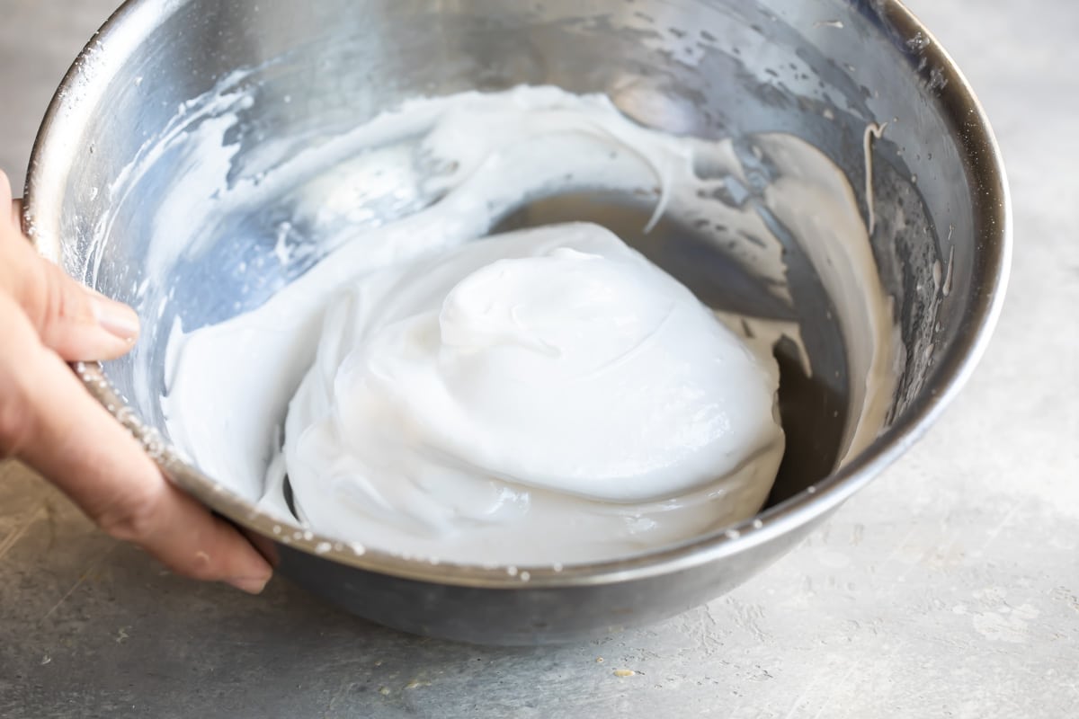 Raw meringue in a mixing bowl.