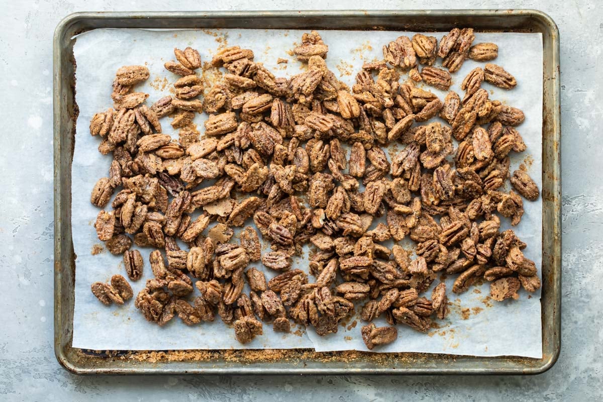 Candied pecans on a baking sheet.