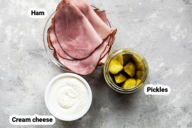 Labeled ingredients for ham roll ups on a countertop.