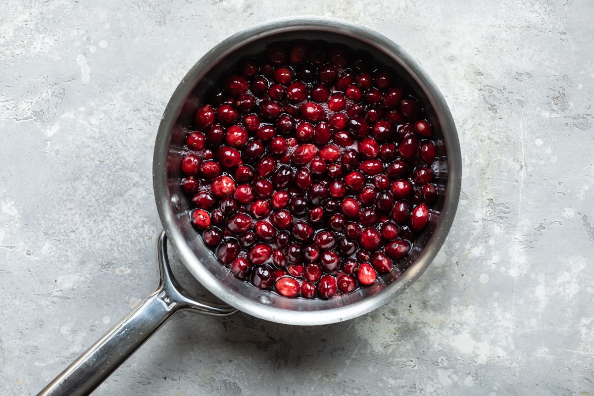 Cranberries in a silver pot.