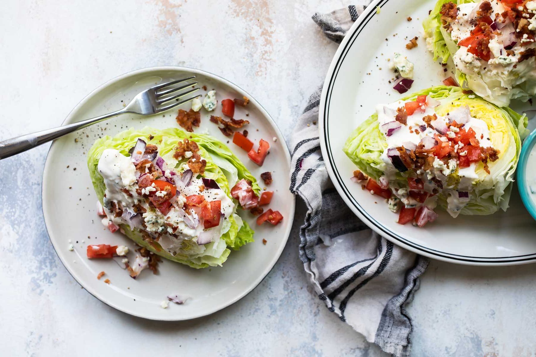 A wedge salad on a plate.