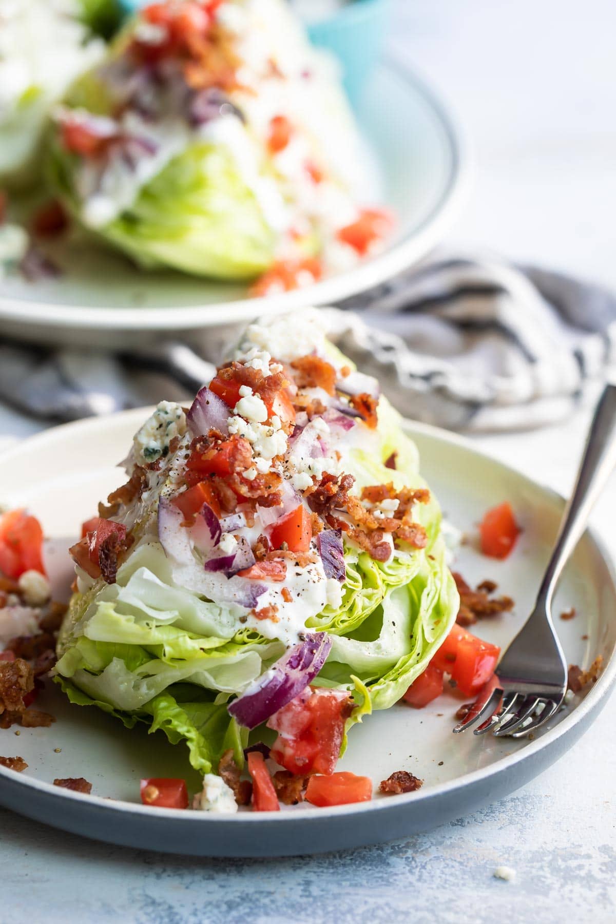 A wedge salad on a plate.