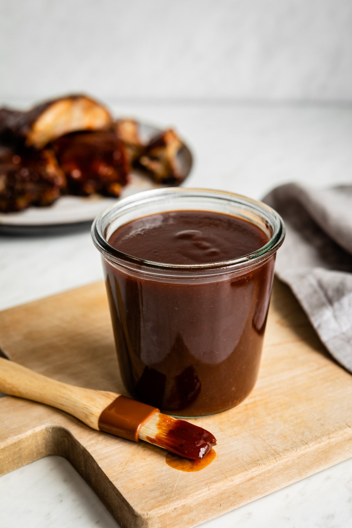 Barbecue sauce in a glass jar.