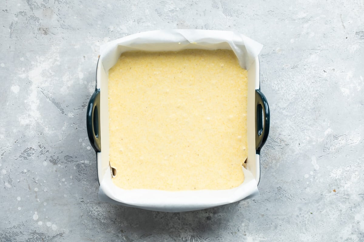 Cornbread batter in a pan before being baked.