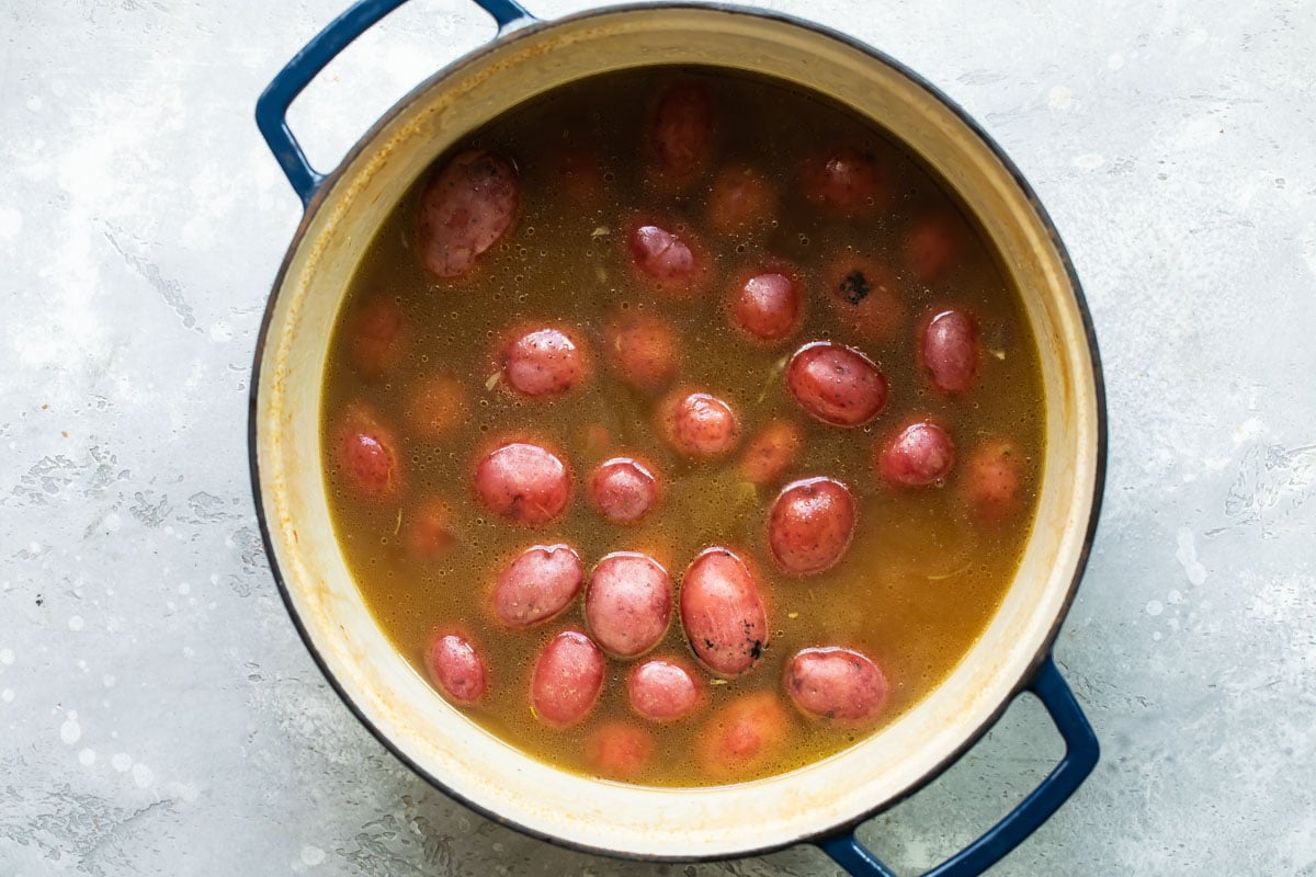 Red potatoes in a pot.
