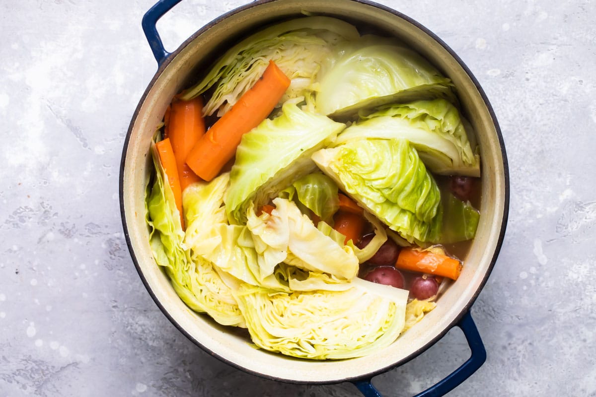 Cabbage and carrots in a pot.