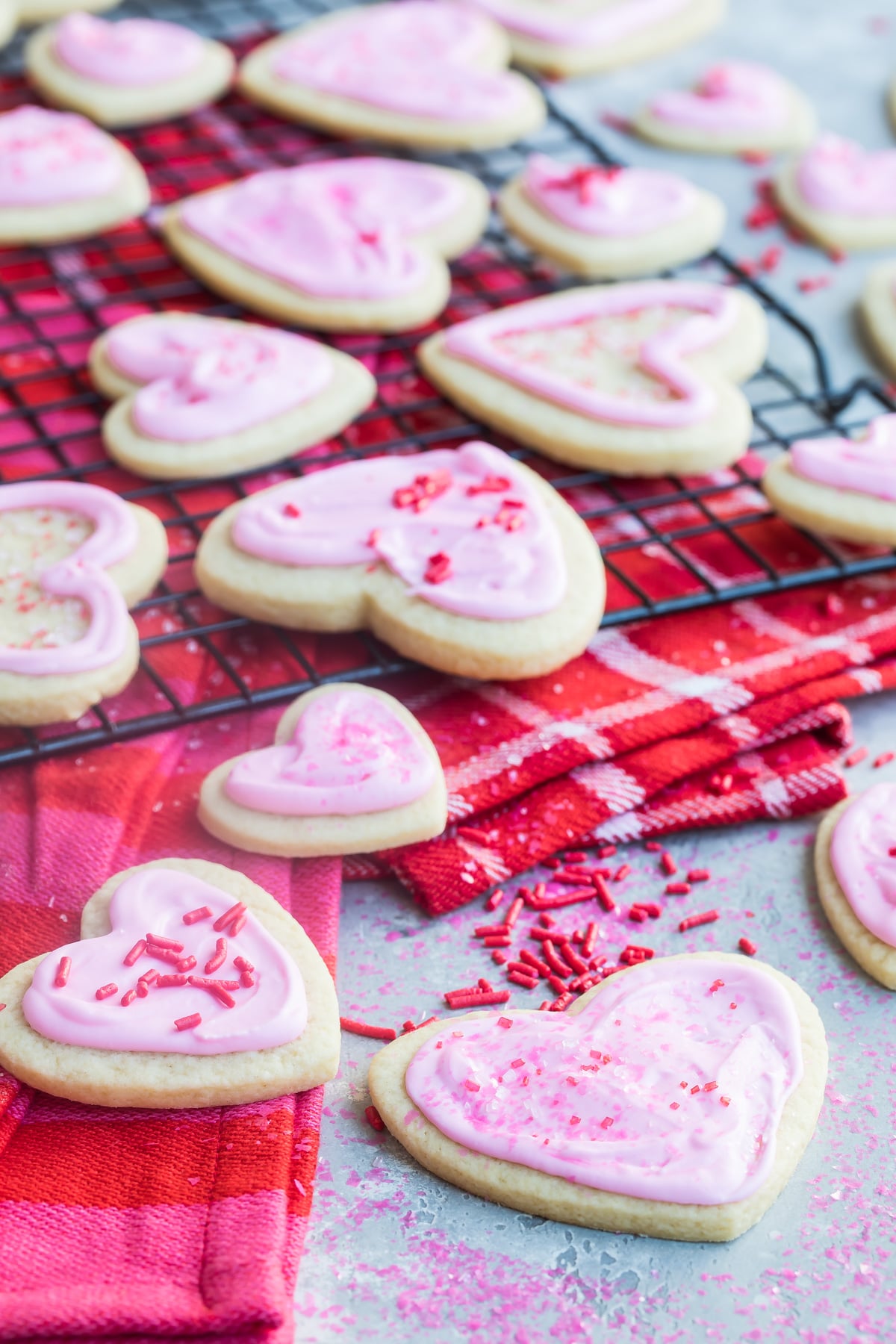 Easy frosted valentine cookies on a cooling rack.
