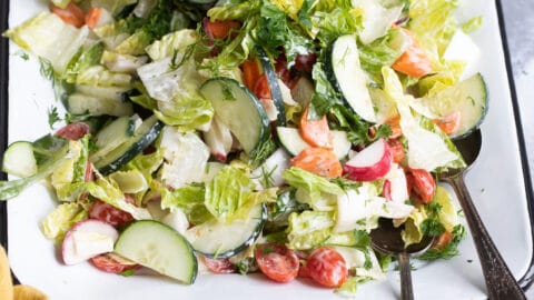 Easy garden salad on a white platter.