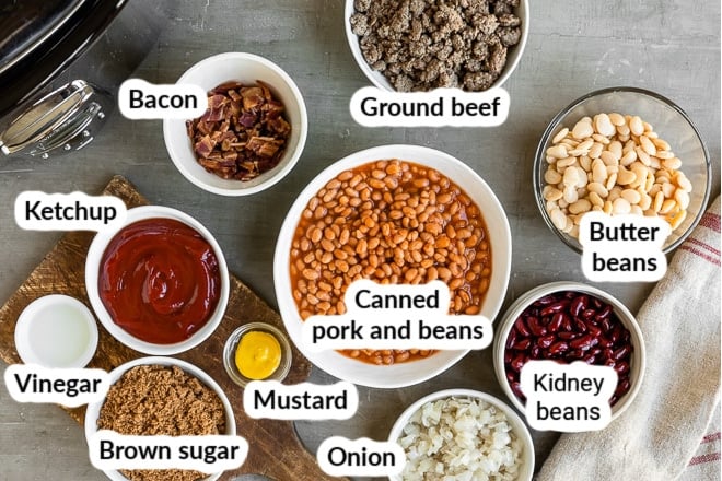 Labeled ingredients for calico beans in various bowls.