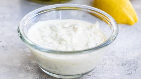Tartar sauce in a small clear portion cup.