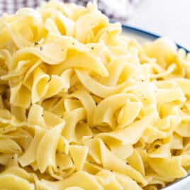 A bowl of buttered noodles.