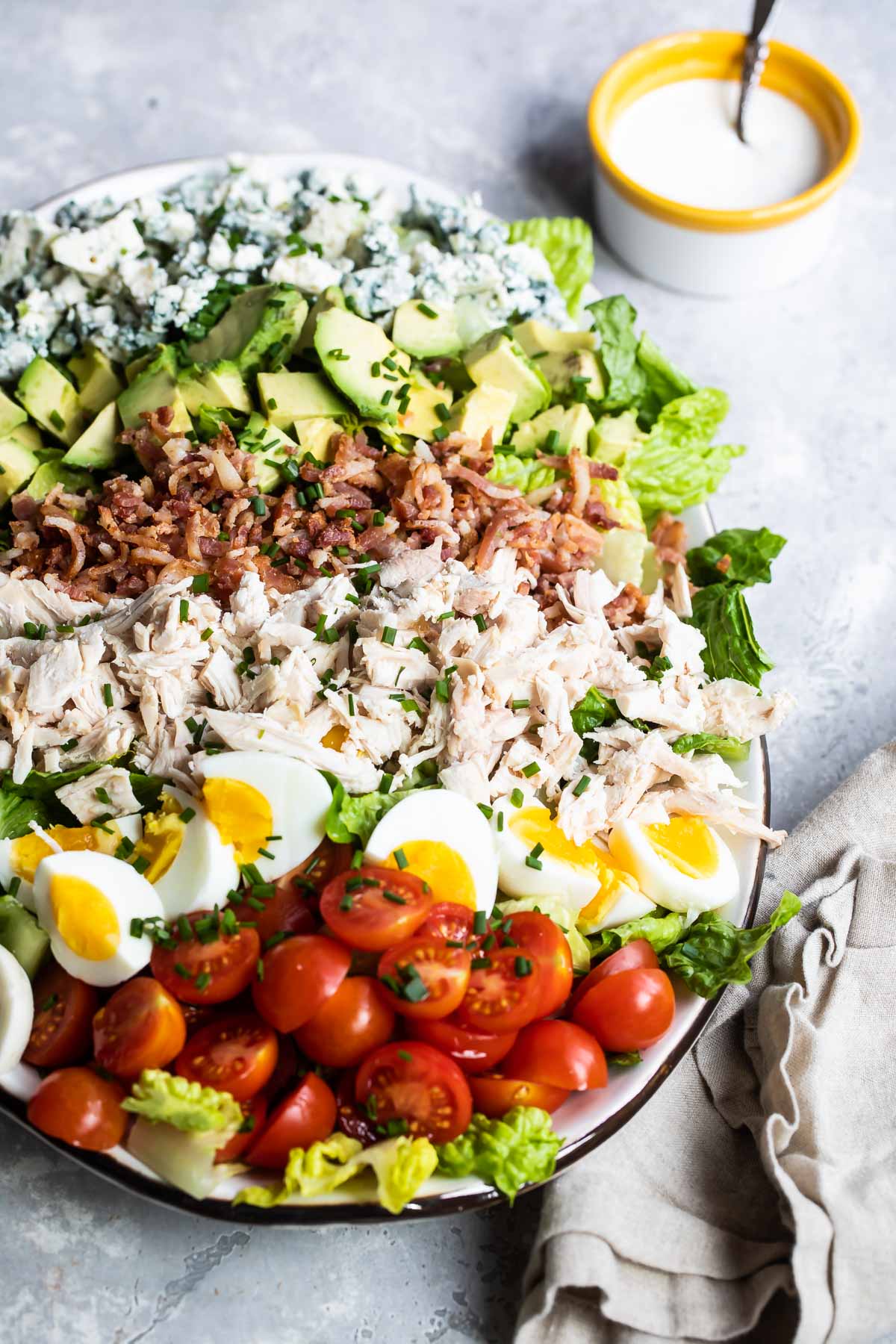 A cobb salad composed on a platter.