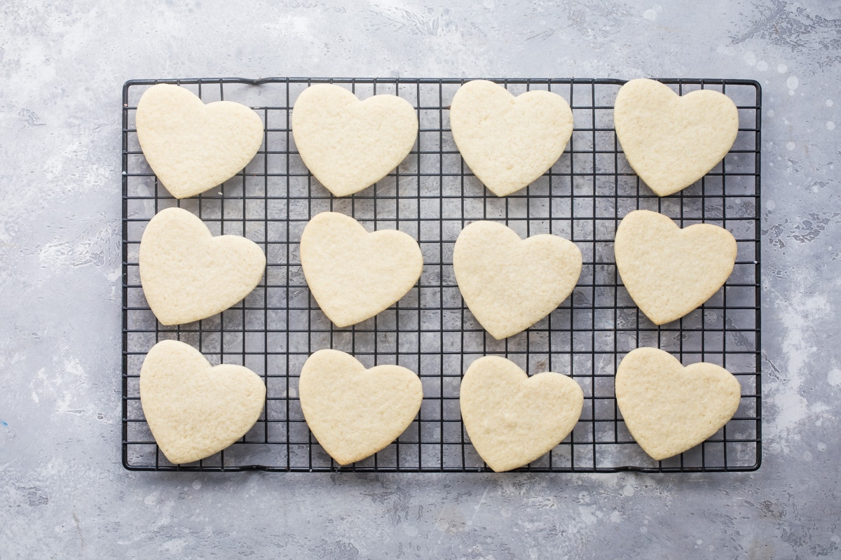 Easy Frosted Valentine cookies baked and on a cooling rack.