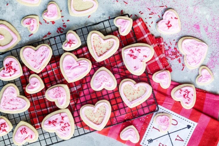 Easy frosted valentine cookies on a cooling rack.