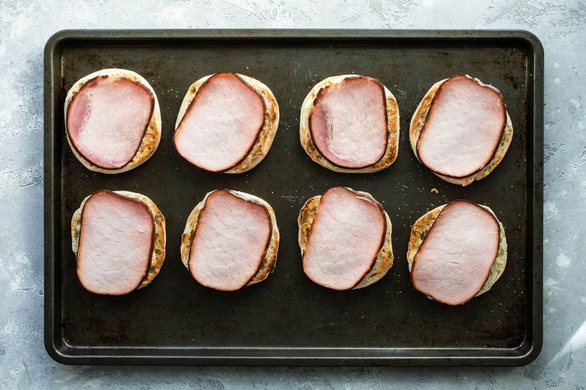 English muffins with Canadian bacon on top.