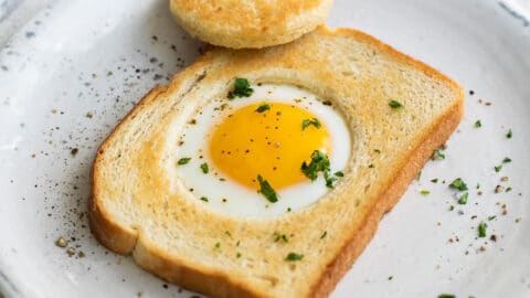 An egg cooked into a piece of bread.