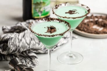 Two grasshopper cocktails in martini glasses.