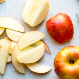 Apple slices on a cutting board.