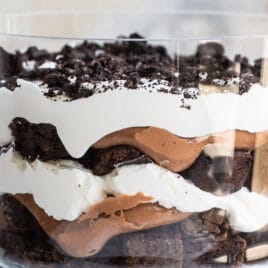 Oreo brownie trifle assembled in a trifle dish.