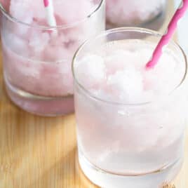 Pink lemonade vodka slush in a short clear glass.