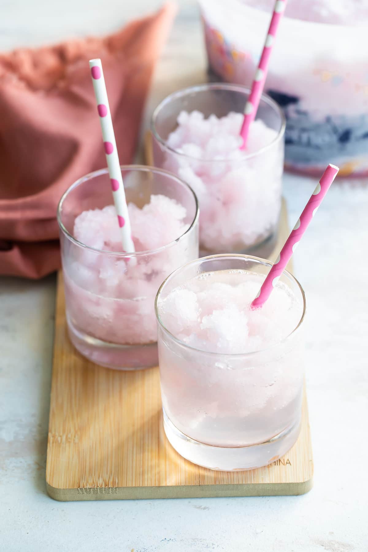 Pink lemonade vodka slush in a short clear glass.