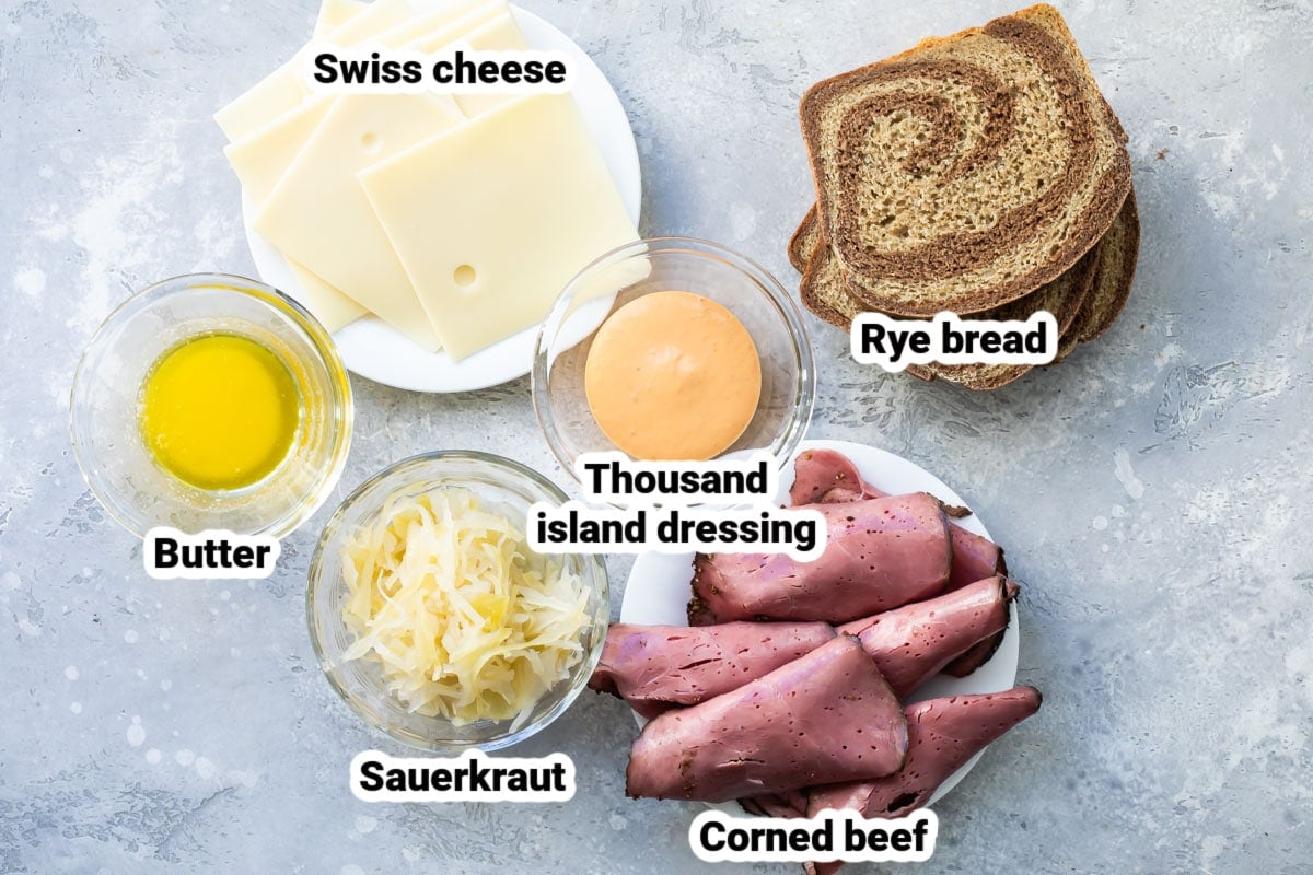 Reuben sandwich ingredients labeled and in various bowls.