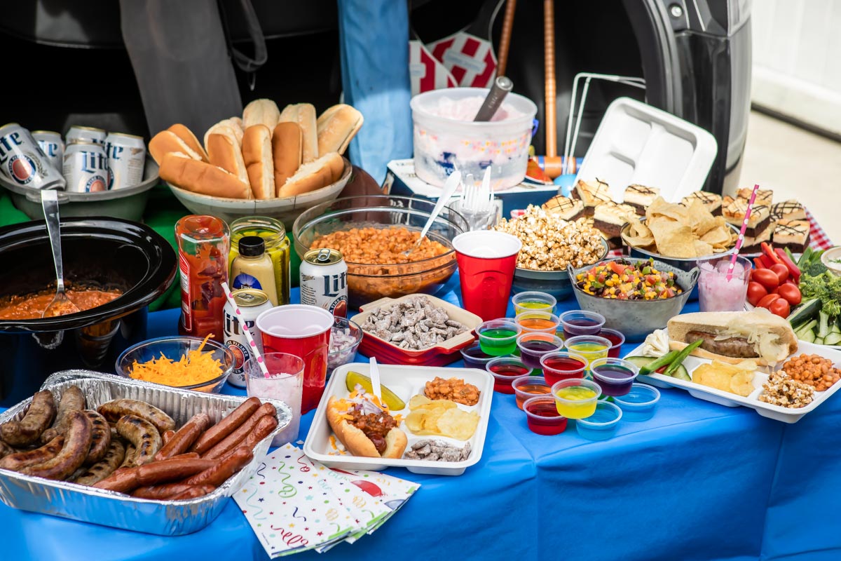 A tailgating spread set up at the back of a car.
