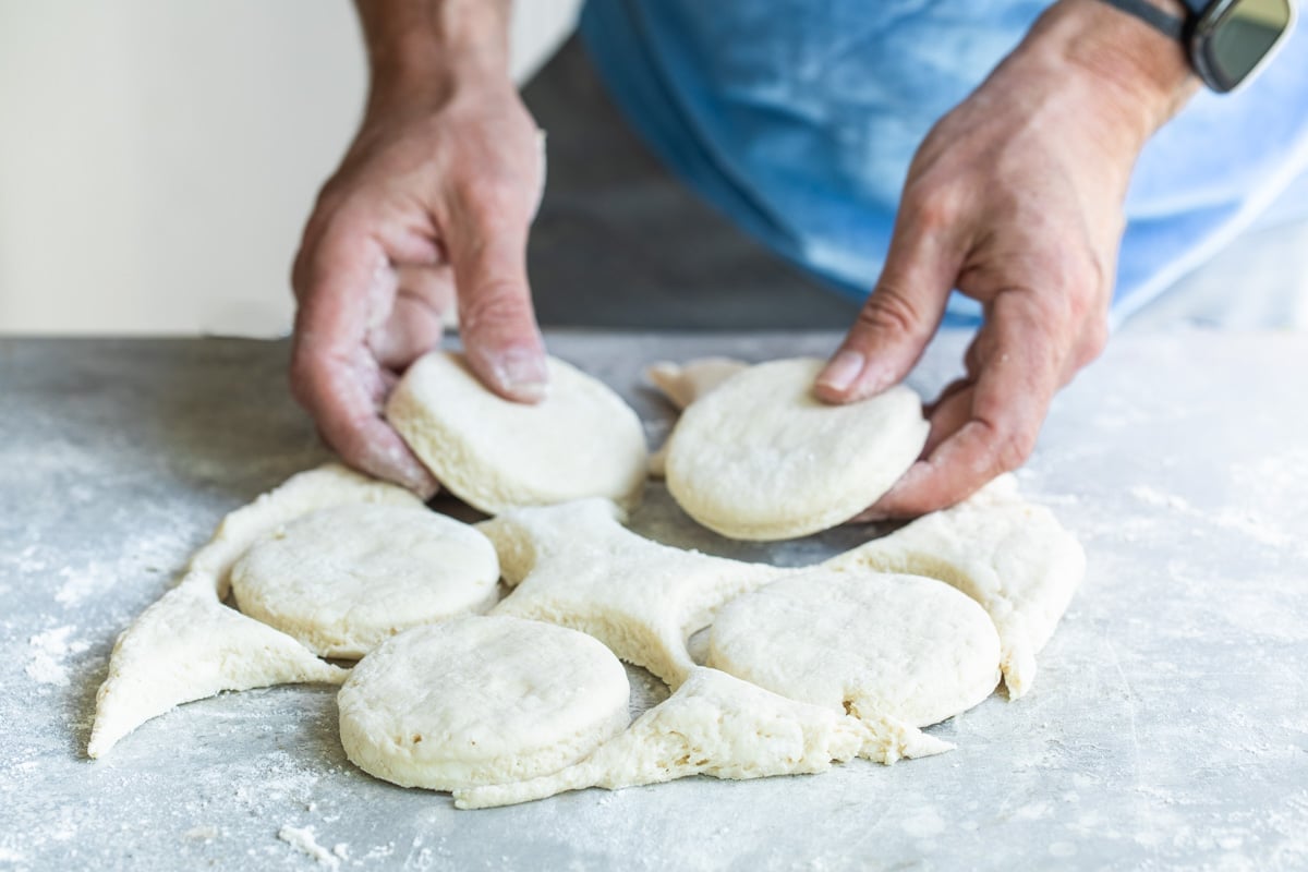 Cutting out biscuits from dough.