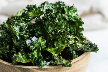 A bowl of baked kale chips.