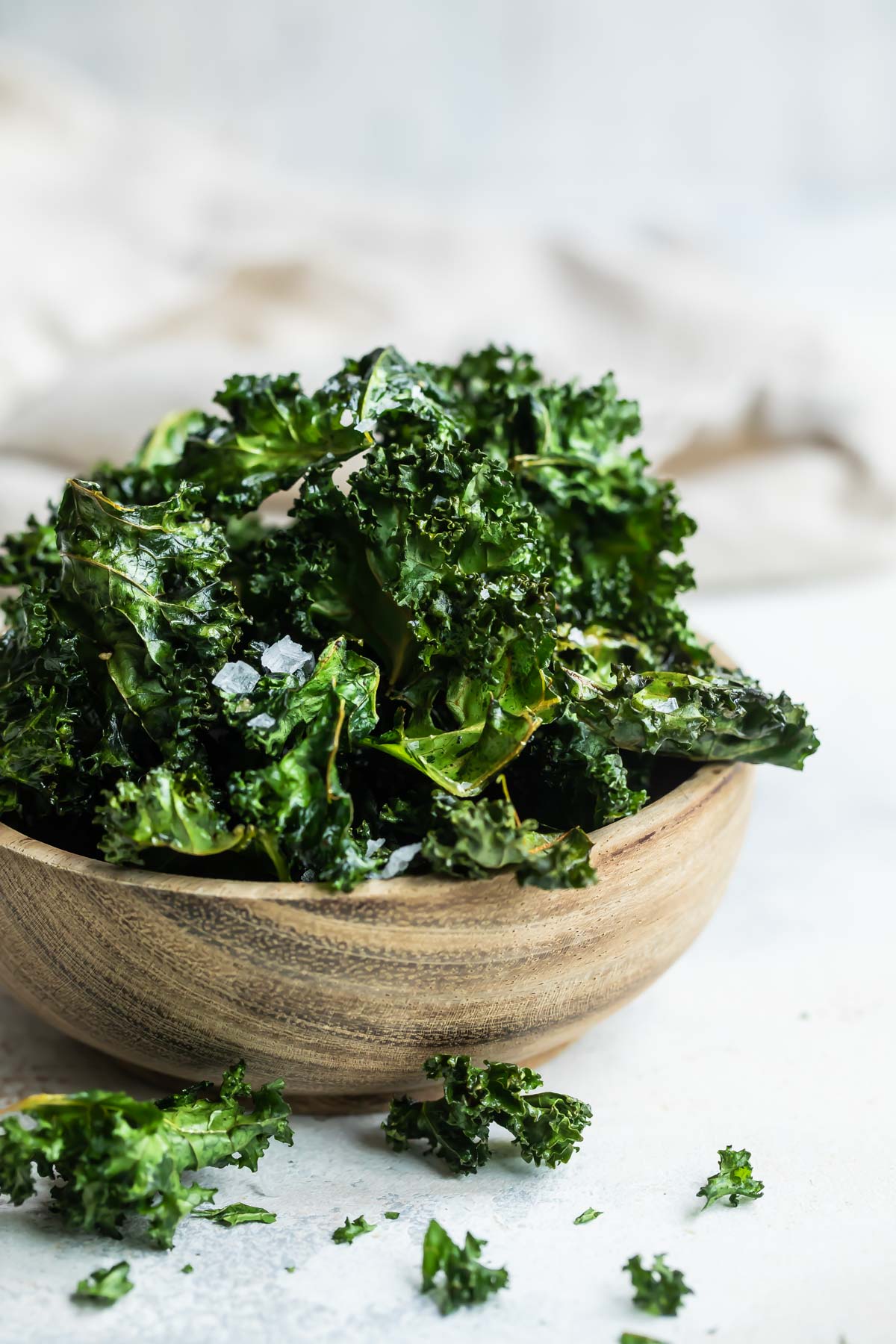 A bowl of baked kale chips.