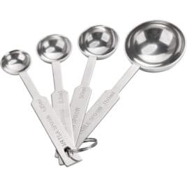 A set of four measuring spoons connected by a metal ring.