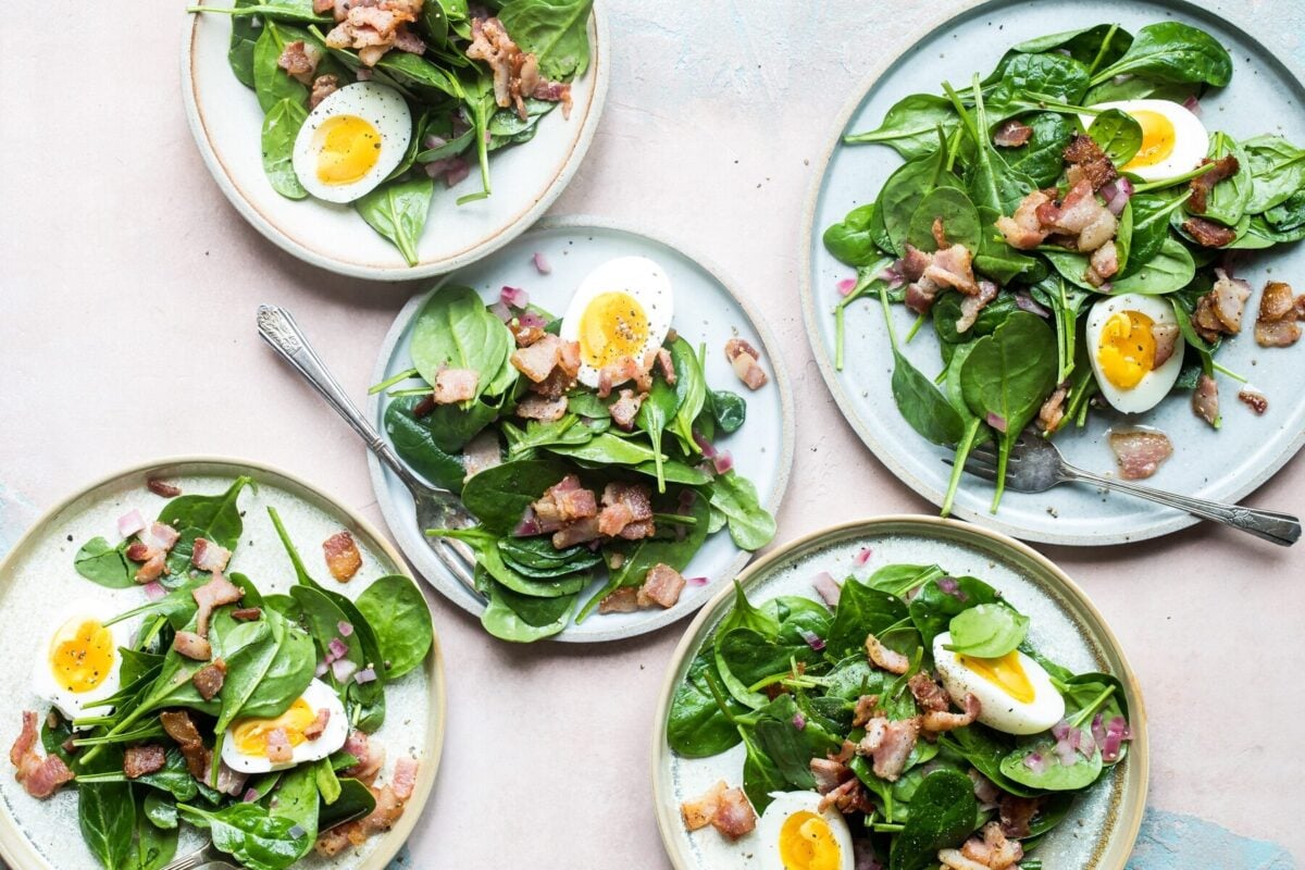 Hot bacon dressing on spinach salad with hard-boiled eggs.