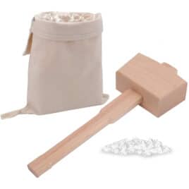 A lewis bag filled with ice, a mallet, and a small pile of ice.