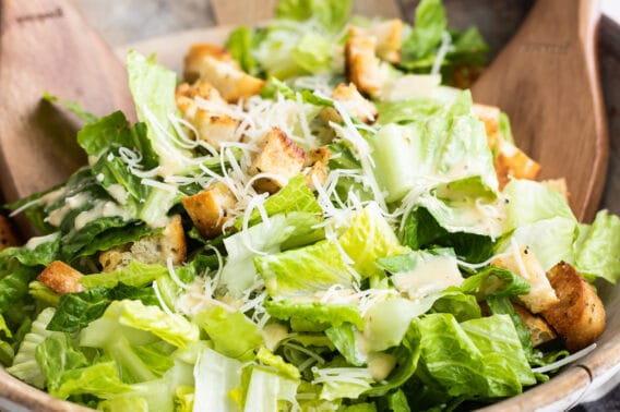 Caesar salad in a wooden bowl.