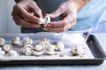 Assembling meringue mushrooms.
